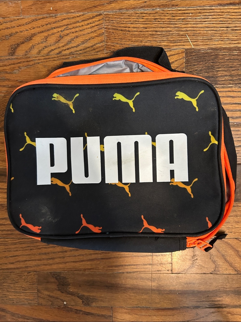 Puma Black Toiletry Bag with Orange and Yellow Puma Motifs